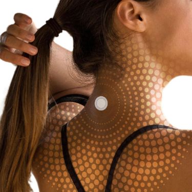 Back view of a woman with a Lifewave X39 patch applied to the back of her neck, with a graphic overlay of concentric circles highlighting the patch area.